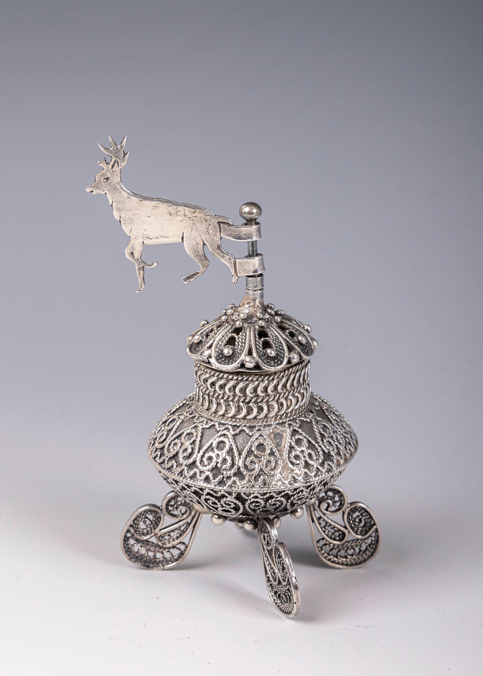 162. A STERLING SILVER SPICE CONTAINER. Israel, modern. On four filigree feet with a solid body (1 of 1)