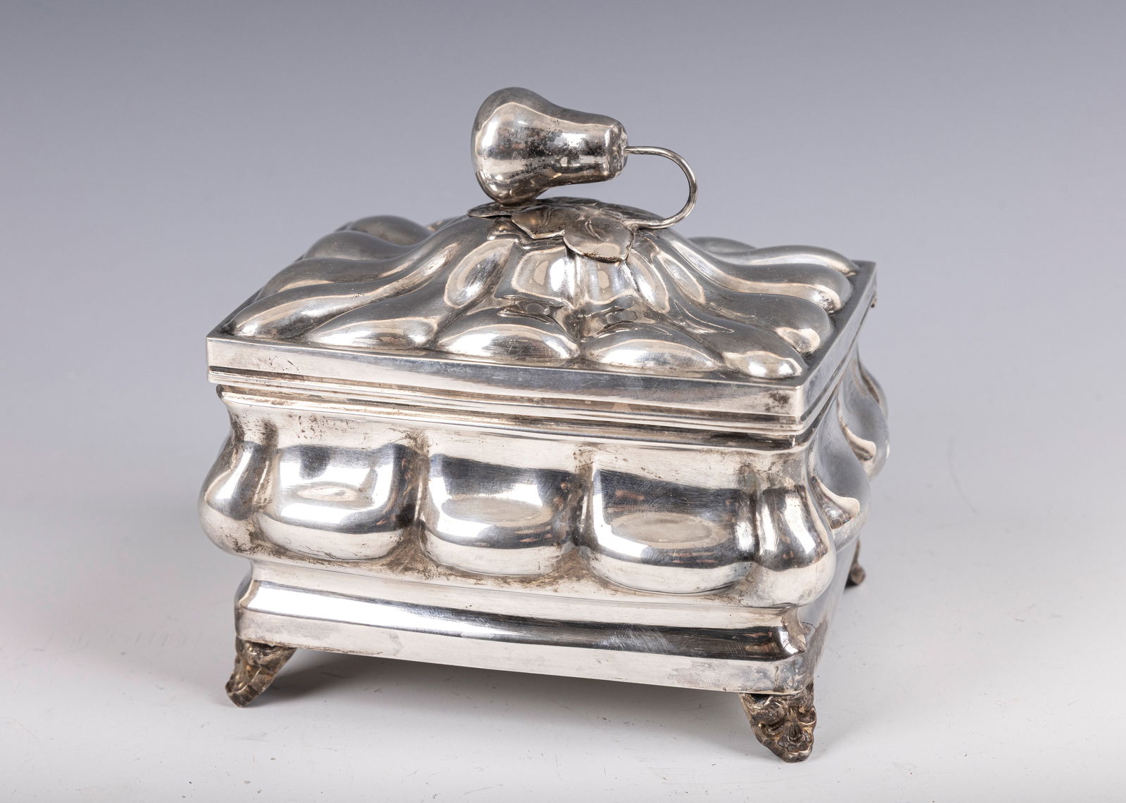 166. A SILVER ETROG CONTAINER. Vienna, c. 1900. On four decorative feet with a chased body in (1 of 1)