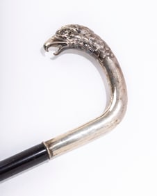 A SILVER EAGLE DRESS CANE. Exceptionally well molded crook silver handle with an eagle head and