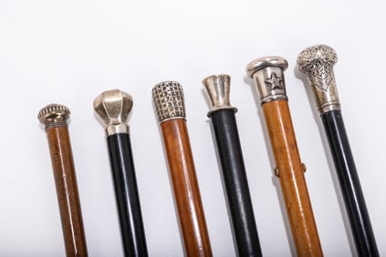 A GROUP OF SIX SILVER HANDLED DRESS CANES. Mostly American, c. 1900. Of various forms which include
