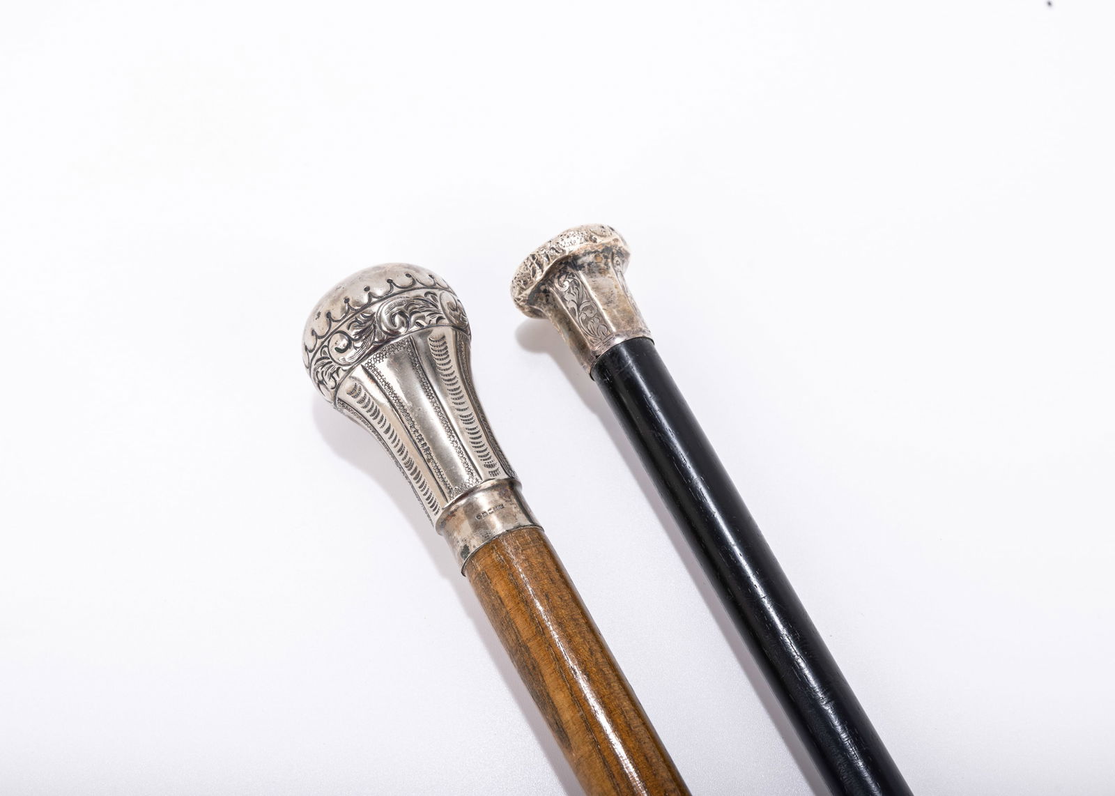 A GROUP OF TWO STERLING SILVER HANDLED DRESS CANES. London, c. 1900. Traditional grip model.  (1 of 6)