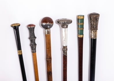 A GROUP OF SIX DRESS CANES. Various sizes and ages. Including a spherical agate handle, a damscene