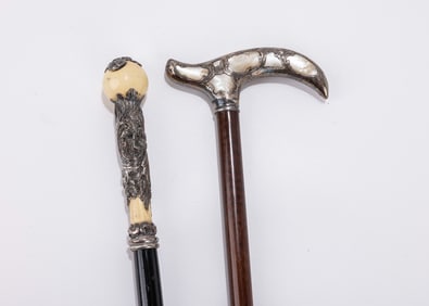 TWO MAGNIFICENT SILVER OVERLAY CANE HANDLED DRESSING STICKS. Probably American, c. 1900. The first