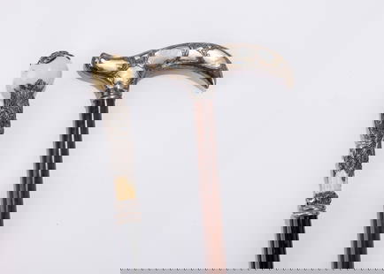 TWO MAGNIFICENT SILVER OVERLAY CANE HANDLED DRESSING STICKS. Probably American, c. 1900. The first: TWO MAGNIFICENT SILVER OVERLAY CANE HANDLED DRESSING STICKS. Probably American, c. 1900. The first one with silver overlay over mother of pearl in derby fashion. The second with silver overlay over a