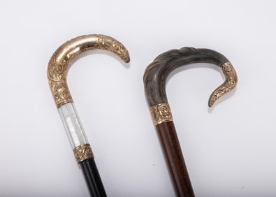 A GROUP OF TWO GOLDFILLED DRESS CANES. Various ages and origins. Of crook handled form.
