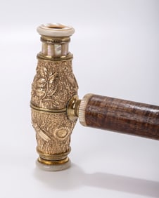 A GOLD FILLED CANE WITH AN OPERA LENSE