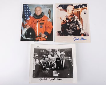 THREE AUTOGRAPHED PHOTOGRAPHS OF JOHN GLENN JR.. One in astronaut garb, one with JFK and one earlier