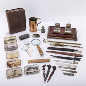 A COLLECTION OF DESK ACCESSORIES AND INKWELL. The inkwell is 10â€? x 6â€? and c. 1920.