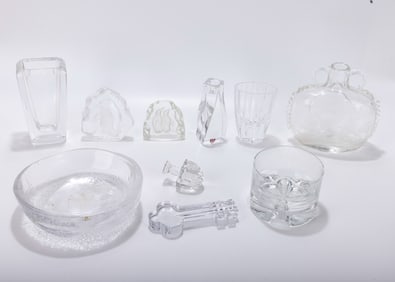 A GROUP OF GLASS AND CRYSTAL TABLE ACCESSORIES. Including bowls, a bottle, &nbsp; vases and cups.