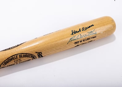 A RARE ERROR BAT SIGNED BY HANK AARON AND EDDIE MATHEWS. Both Baseball Hall of Famers. Hillerich