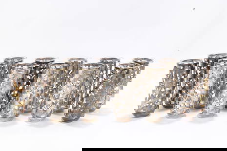 A GROUP OF 12 STERLING SILVER OVERLAY DRINKING GLASSES. Probably South American, c. 1950. Decorated: A GROUP OF 12 STERLING SILVER OVERLAY DRINKING GLASSES. Probably South American, c. 1950. Decorated with lattice work overlay engraved with leaf designs. 5.5" tall each.