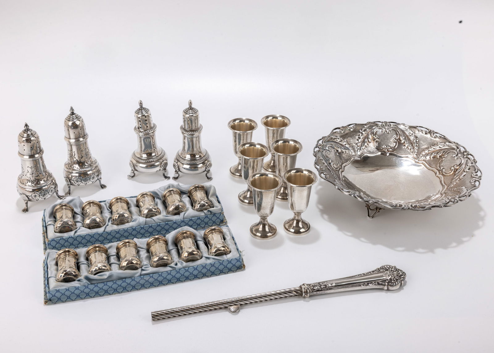 A GROUP OF STERLING SILVER TABLEWARE. Including 12 small salt shakers, 4 large ones, a bowl, six (1 of 1)
