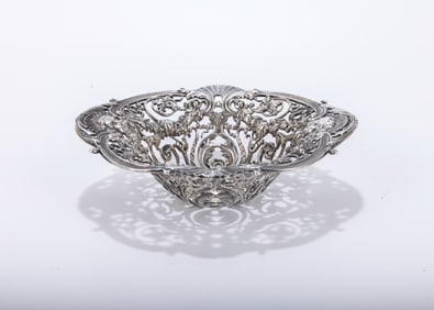 A STERLING SILVER CANDY DISH BY GORHAM. American, c. 1910. Decorated with cherubian masks and other
