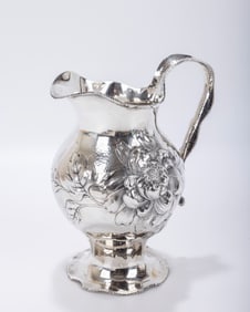 A STERLING SILVER ART NOUVEAU WATER PITCHER BY INTERNATIONAL SIMPSON HALL MILLER. United States,