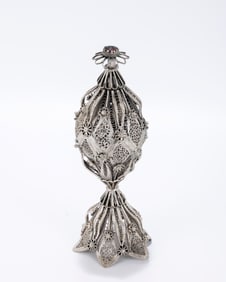 A SILVER FILIGREE SPICE CONTAINER. Probably Palestine or the Ottoman Empire, c. 1920. On a domed