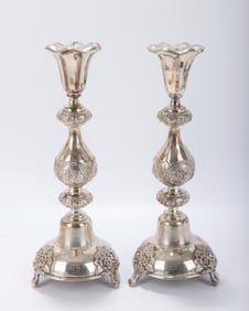 A PAIR OF LARGE SABBATH CANDLESTICKS BY HANDELSMAN. Warsaw, Poland. On grapevine bases that are