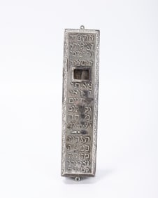 A SILVER MEZUZAH CASE. Germany, early 20th century. Probably Hanau. Embossed with blessings for
