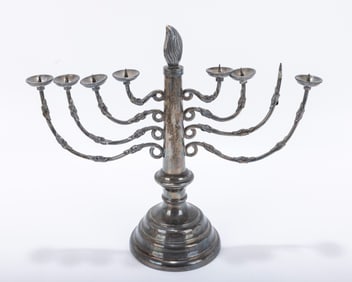 A SILVER PLATED MENORAH. Germany, c. 1890. On a round base with eight candle holders. Lacking one