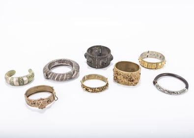 A GROUP OF EIGHT YEMENITE BRACELETS. Yemen, 19th and 20th centuries. Consisting of brass, silver and