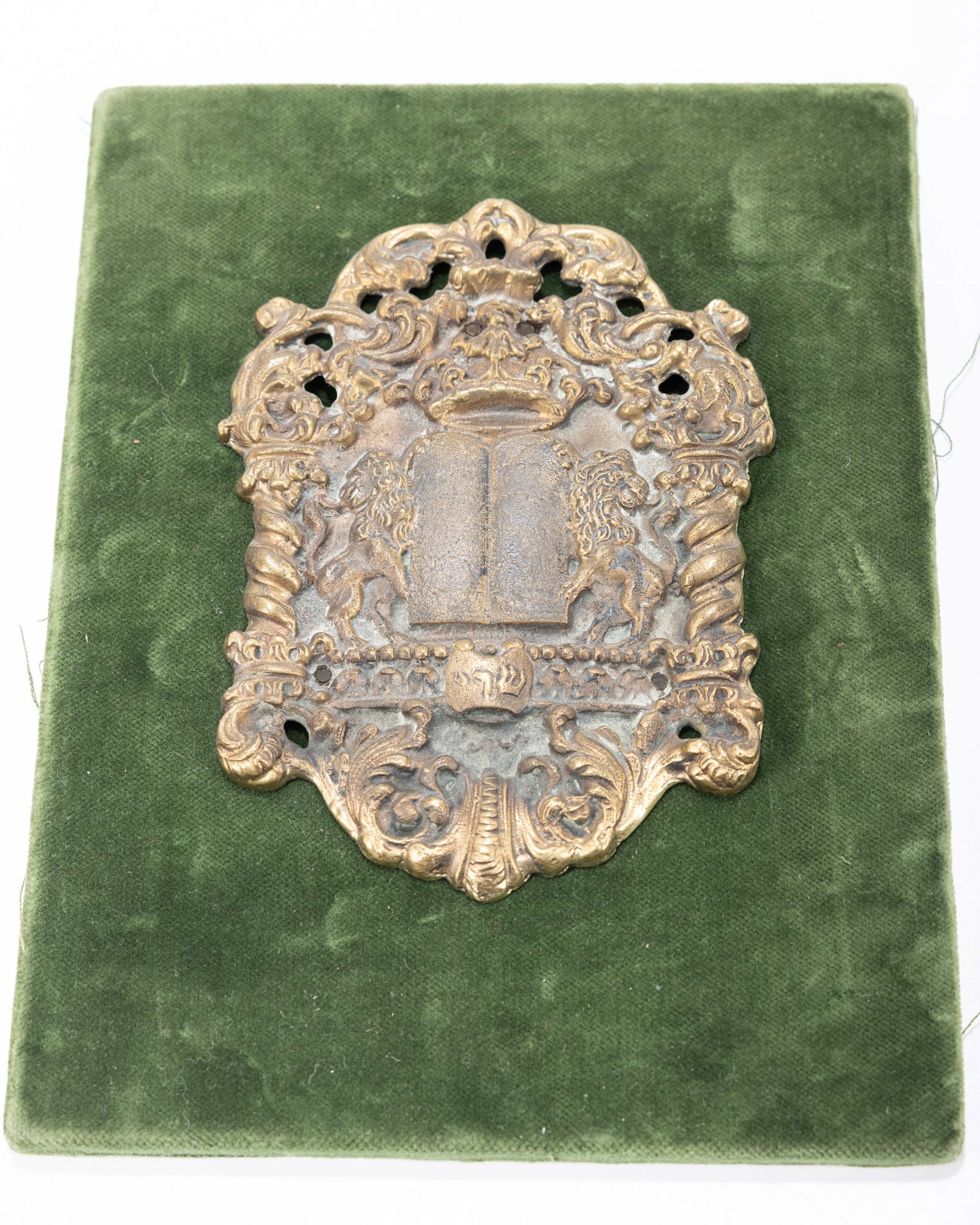 A PARCEL GILT SILVER AMULET. Continental, 20th century. In traditional form. (1 of 1)