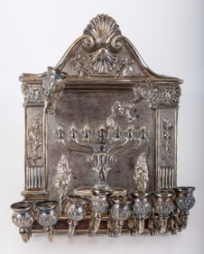 A MAGNIFICENT WALL MOUNTED SILVER HANUKKAH LAMP. Italy, 20th century. Hand chased with shell