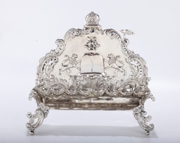 A SILVER HANUKKAH LAMP. Vienna, c. 1880. On four legs with spoon shaped oil fonts. The backplate is