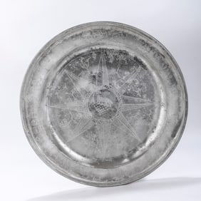 Â A MONUMENTAL PEWTER SEDER TRAY. Germany, c. 1817. Engraved in the center with a ram. Periphery