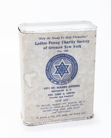 A TIN CHARITY CONTAINER COLLECTING FUNDS FOR THE LADIES PENNY CHARITY SOCIETY OF GREATER NEW YORK.