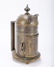 A LARGE BRASS CHARITY CONTAINER. Europe, c. 1900. Tankard shape. With the original carrying handle.