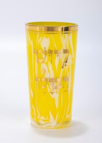 A BOHEMIAN YELLOW GLASS KIDDUSH/HAVDALAH BEAKER. Bohemia, c. 1900. With applied gold leaf indicating