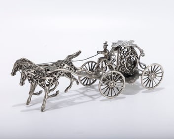 A SILVER WAGON FORM SPICE BOX. Continental, c. 1900. On four wheels with four wheels and two horses.