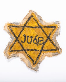 A REPRODUCTION YELLOW STAR. Probably Continental, 20th century. Spelling out JUDE.