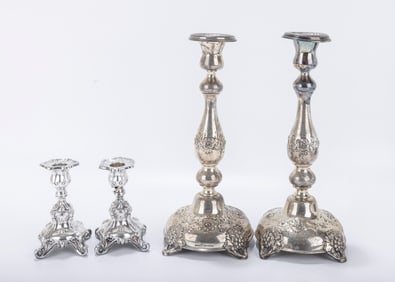 TWO SETS OF SILVER CANDLESTICKS. One small modern pair of sterling silver candlesticks and one pair
