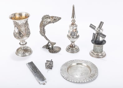 A GROUP OF SILVER JUDAICA. Including three spice towers, a kiddush cup and a silver plate.