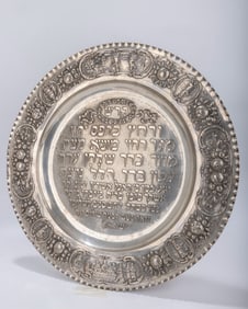 A LARGE SILVER SEDER TRAY. Germany, c. 1900. Decorated with scenes from the Haggadah and the order