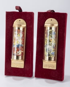 TWO MEZUZAHS BY MENACHEM BERMAN. Israel, c. 1980. Each incorporating and celebrating a painting by