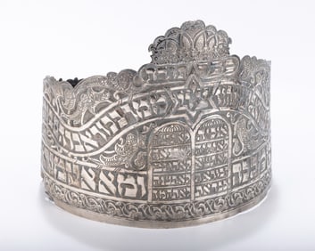 A LARGE SILVER TORAH CROWN BY EMUNATH MIZRACH WORKSHOP. Tel-Aviv, 1952Â  By Shlomo and Moshe Hand