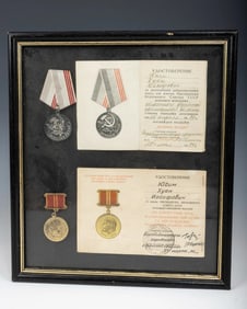 TWO FRAMED SOVIET AWARDS. The first for conscientious work on behalf of the presidium of the Supreme