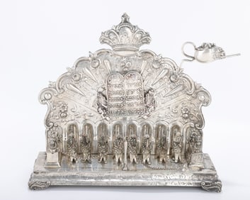 A LARGE SILVER HANUKKAH LAMP. Germany c. 1880. On scrolling feet. THe backplate is decorated with