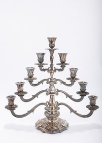 A STERLING SILVER MENORAH BY BUCCELATI. Italy, c. 1990. On a stylized circular base with classical