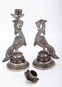 A PAIR OF SILVER CANDLESTICKS. Probably India, 20th century. Each in the shape of a swan. On
