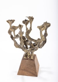 AN EIGHT LIGHT BRASS LAMP. Most likely Menachem Berman.