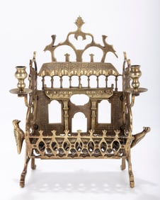 A BRASS SYNAGOGUE SHAPED HANUKKAH LAMP. In Polish style, 20th century. In the shape of a wooden