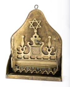 A LARGE BRASS HANUKKAH LAMP. The Netherlands, c. 1900. Hanging model. Formed with eight oil holders