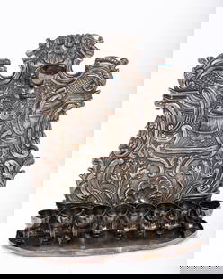 A RARE STERLING SILVER HANUKKAH LAMP BY BUCCELlATI. Italy, late 20th century in 18th century style.: A RARE STERLING SILVER HANUKKAH LAMP BY BUCCELlATI. Italy, late 20th century in 18th century style. Embossed foliate design. Marked Buccellati, Italy, 925. 10" tall.635.2 grams