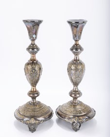 A PAIR OF SABBATH CANDLESTICKS BY NORBLIN. Poland, c.1880. Decorated with floral designs. 14.5"