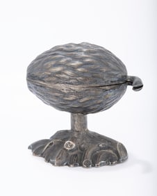 A SILVER ETROG CONTAINER. Germany, c. 1870. On a leafy base with a stem that attaches to the upper