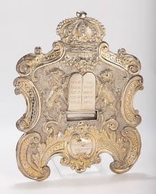 A LARGE SILVER TORAH SHIELD. Vienna, c. 1915. Embossed with two lions flanking a Decalogue, a crown
