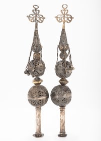 A PAIR OF SILVER TORAH FINIALS. Djerba, Tunisia, 19th century. On round bases with tubular staves.