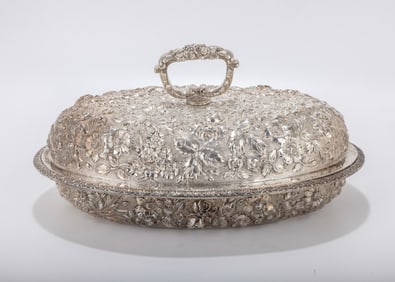 A STERLING SILVER COVERED SERVING DISH BY KIRK.  Hand embossed. 11.2 inches x 7.5 inches x 6 inches.